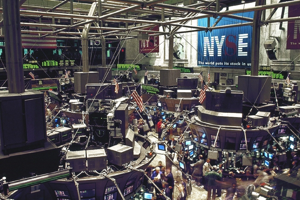 Beginner trader studying financial charts and market data while learning to trade