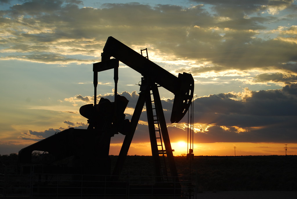 Oil pump jack extracting crude oil, an energy commodity covered by CommoTradeAI