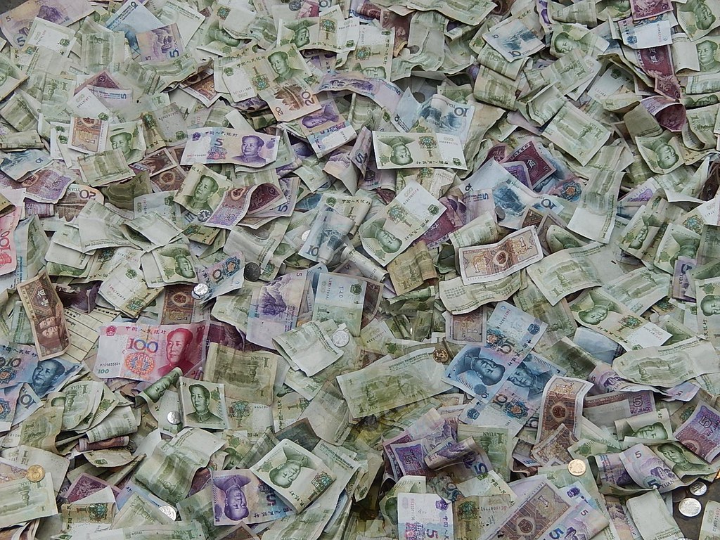 Stacks of paper banknotes representing the global currencies traded in the forex market
